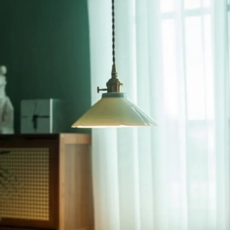 Cream-colored vintage-style pendant light with brass fixture and chain for dining room decorbites cyan ceramic led use