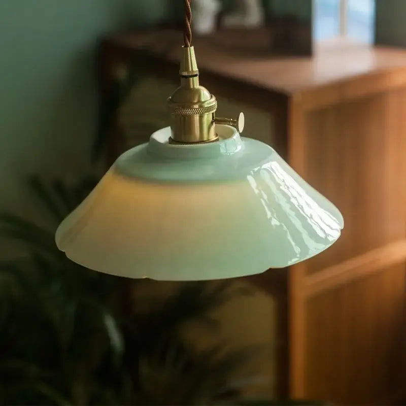 Vintage pale green glass pendant light with brass finish hanging lamp featuring a mint-green ceramic led decorbites design