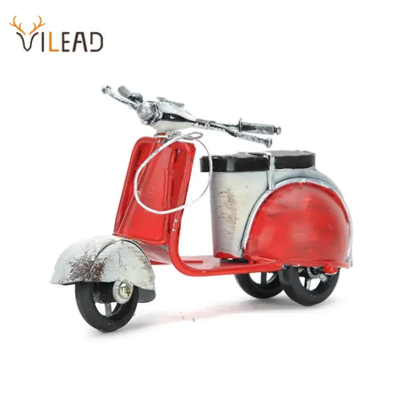 Vintage red and silver metal sheep motor figurines with black wheels for stylish living room decor