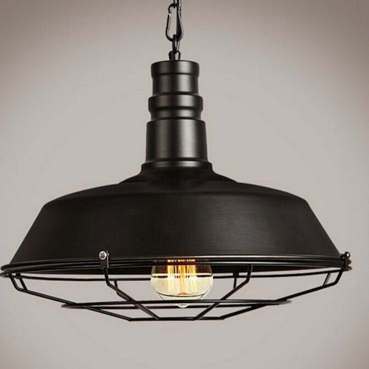Black industrial cage pendant light with exposed bulb and metal frame.