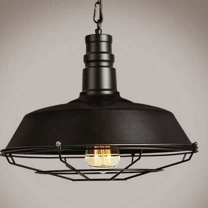 Black industrial cage pendant light with exposed bulb and metal frame.