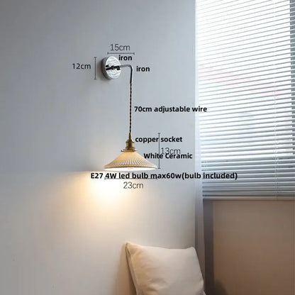 Vintage ribbed glass and brass wall sconce with a brass-finished copper socket, white ceramic shade, and adjustable iron arm decorbites ceramic led wall