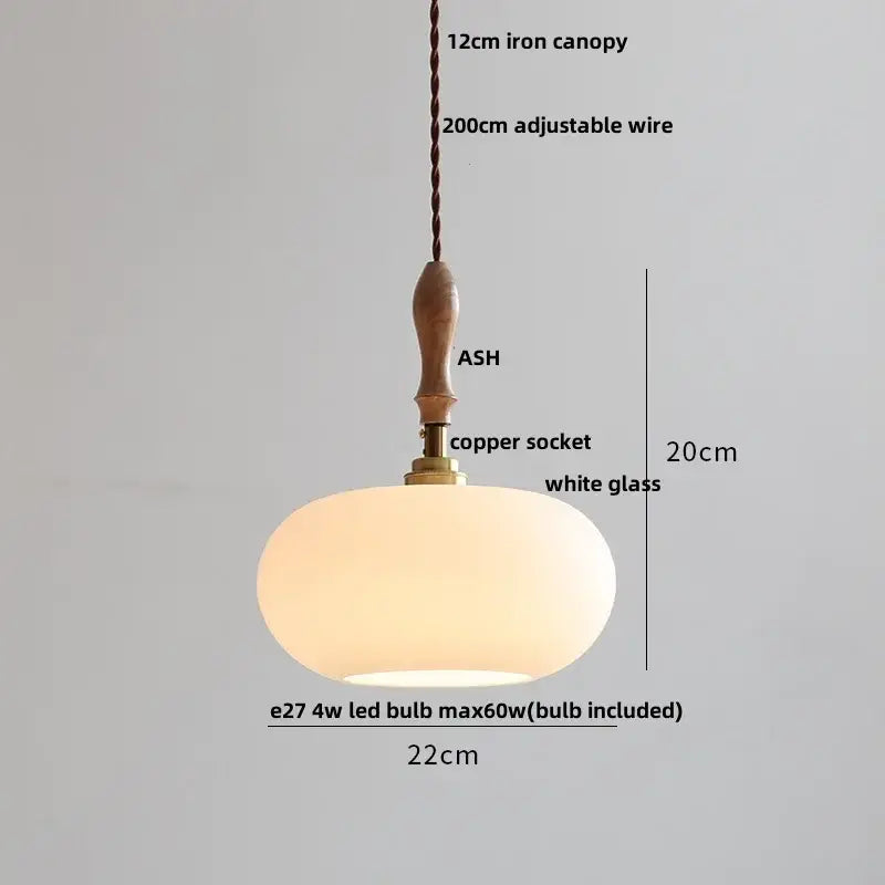 A warm glowing white glass pendant light with wooden handle and copper socket decorbites ceramic led pendant light