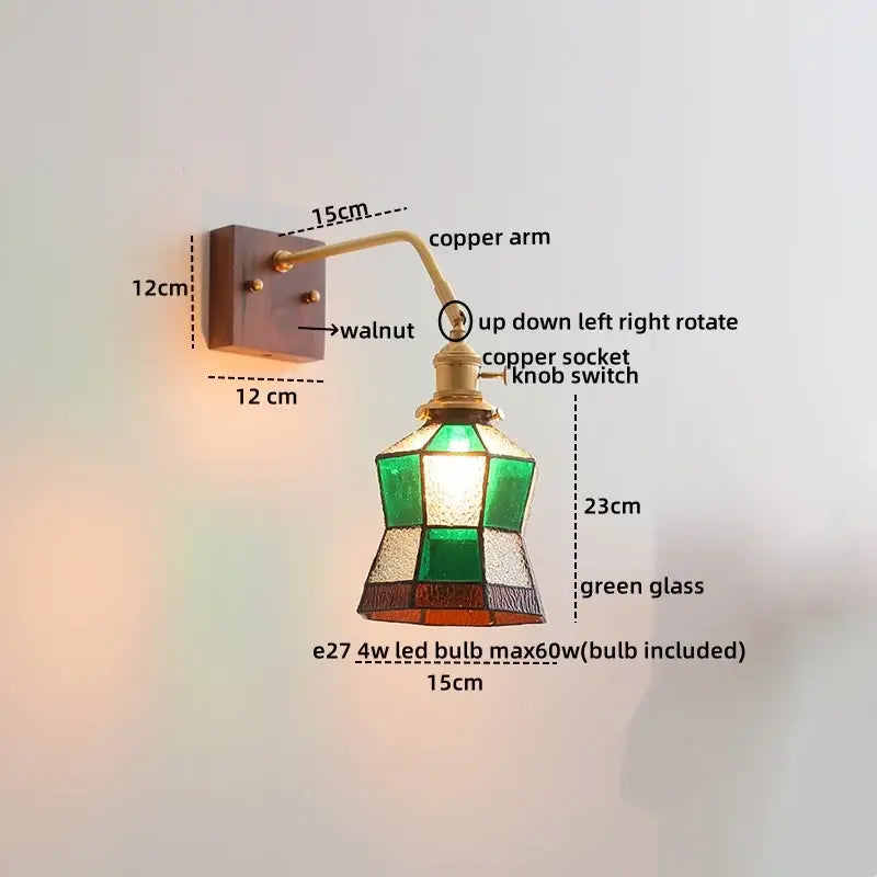 Vintage-style wall lamps with ceramic copper led, walnut mounting plate, and stained glass shade in green and amber tones