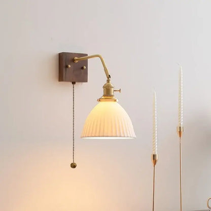Brass-finished adjustable wall lamps with ribbed off-white glass shade and dark wood mount for decorbites ceramic copper led lighting