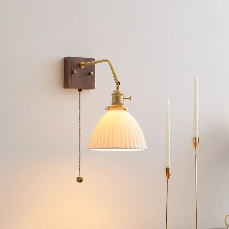 Brass-finished adjustable wall lamps with ribbed off-white glass shade and dark wood mount for decorbites ceramic copper led lighting
