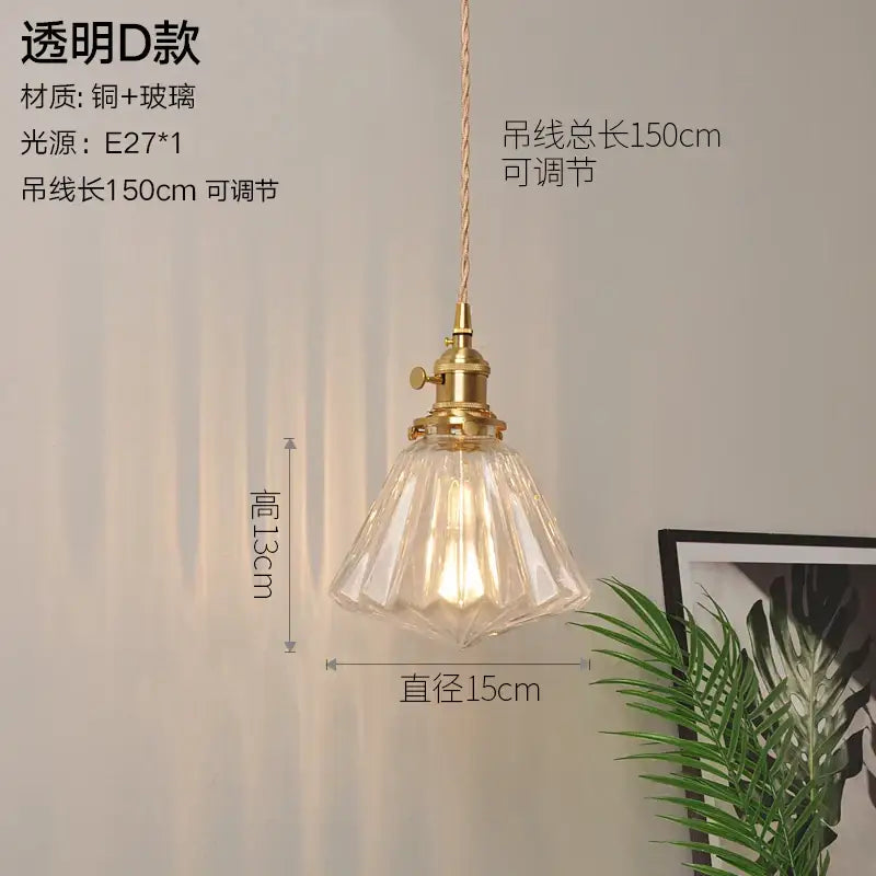 Clear faceted glass copper pendant light with brass finish and adjustable cord for kitchen or dining room use