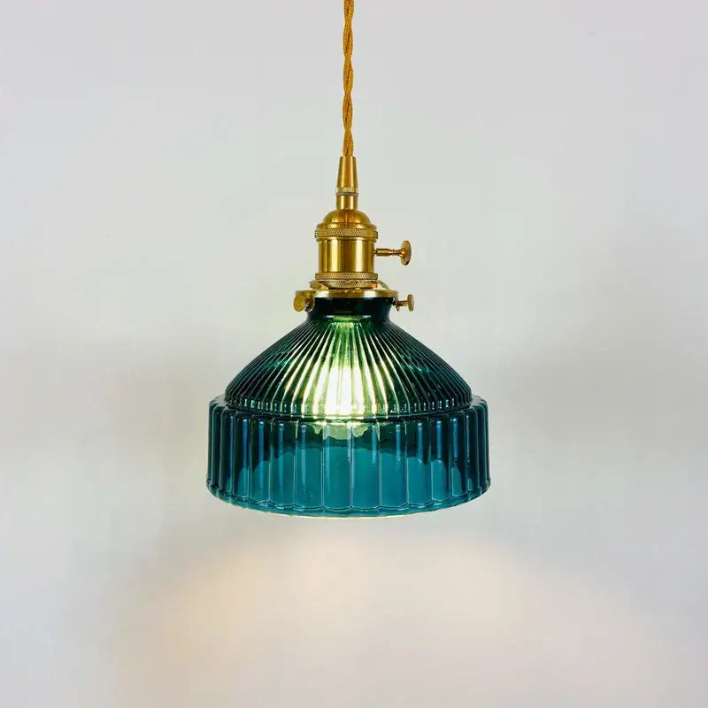 Vintage teal ribbed glass pendant light with brass fixture and twisted cord ideal for dining room lighting