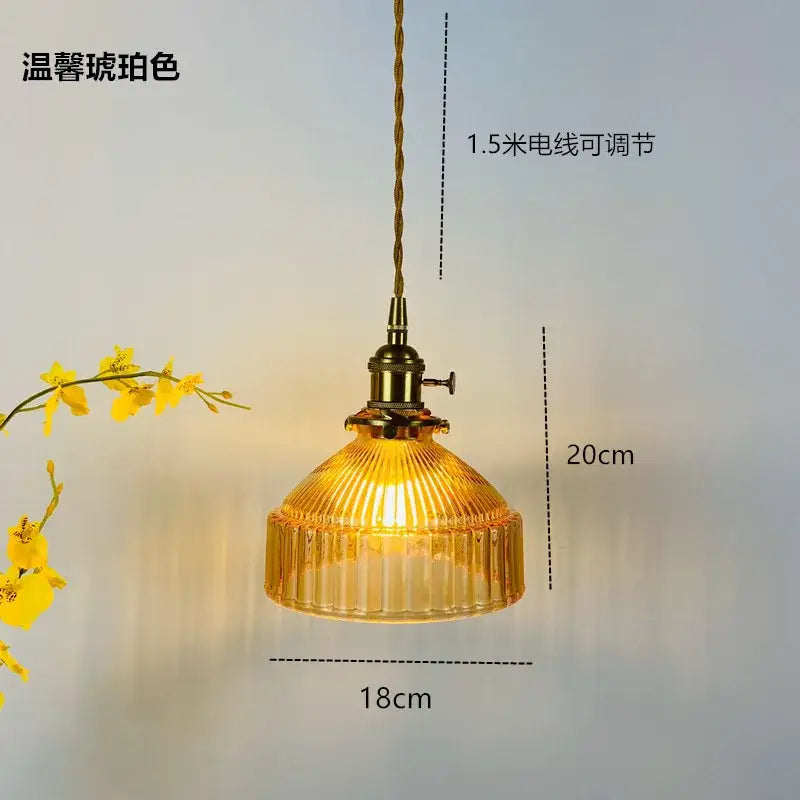 A warm amber glass pendant light with brass fixture and twisted cord for decorbites glass hanging lamp decor