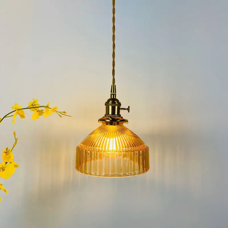 A warm amber glass pendant light with ribbed vintage-inspired design and brass hardware for decorbites glass hanging lamp