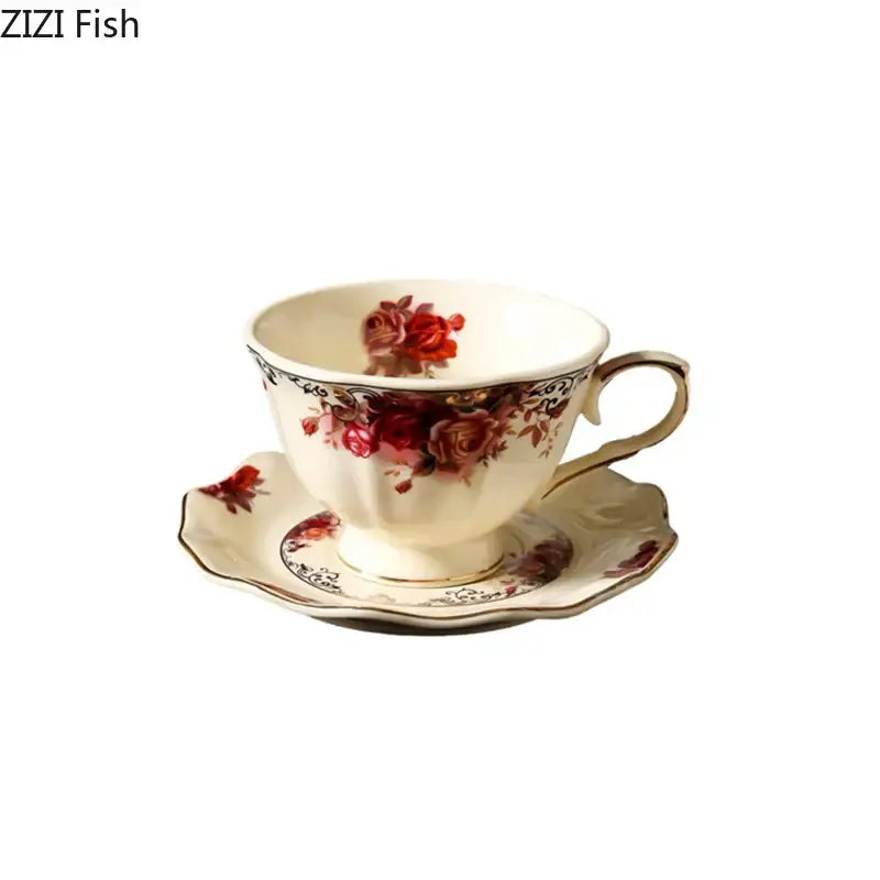 Cream-colored porcelain coffee mug with delicate red rose patterns and golden edge in a vintage dining room set