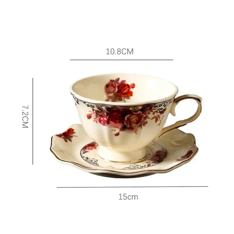 Cream-colored porcelain coffee mug and saucer set with red rose patterns and gold trim for vintage dining room use