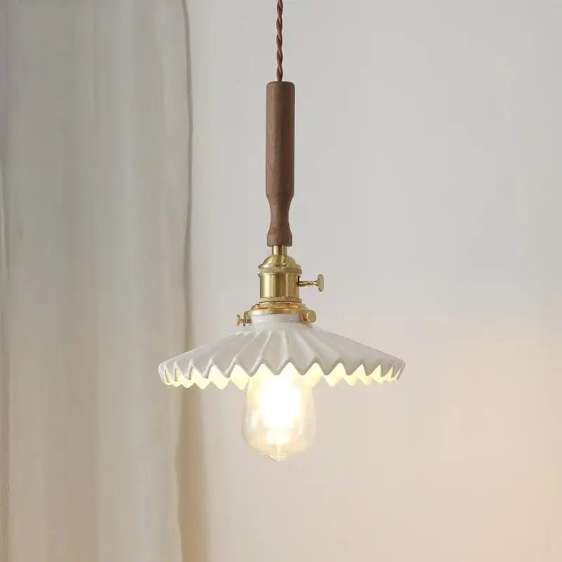 Vintage white scalloped glass pendant light with walnut wood handle and brass fixture for dining room lighting