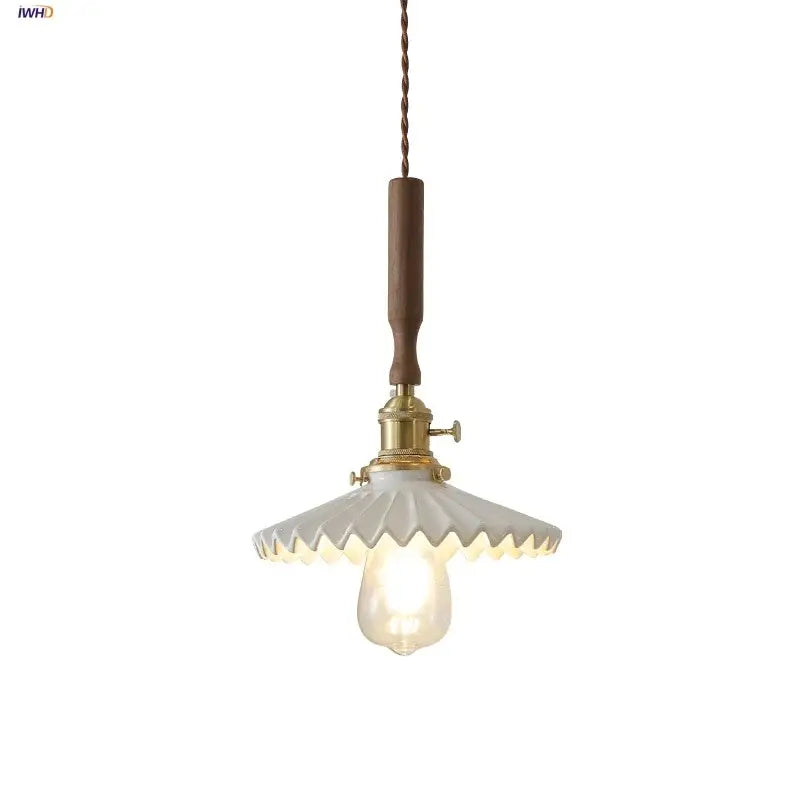 Vintage pendant light fixture with scalloped off-white glass shade and walnut wood handle for dining room lighting