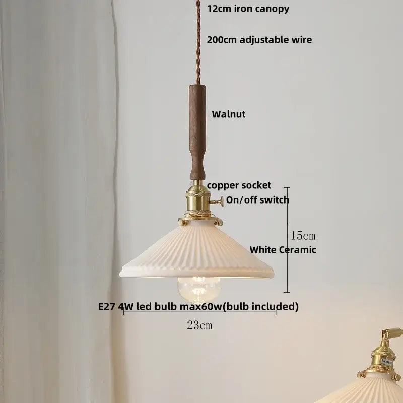 White ceramic pendant light fixture with fluted design and walnut wood handle for dining room lighting