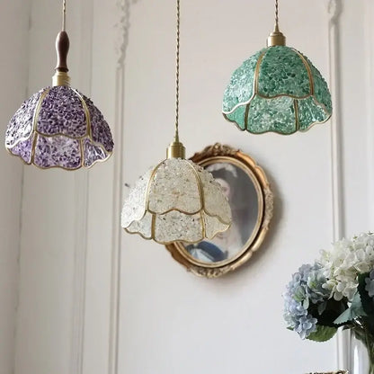 Three hanging pendant lamps with mosaic glass shades in purple green and clear framed by gold-toned metal walnut led pendant decorbites copper walnut