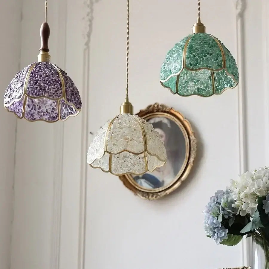 Three hanging pendant lamps with mosaic glass shades in purple green and clear framed by gold-toned metal walnut led pendant decorbites copper walnut