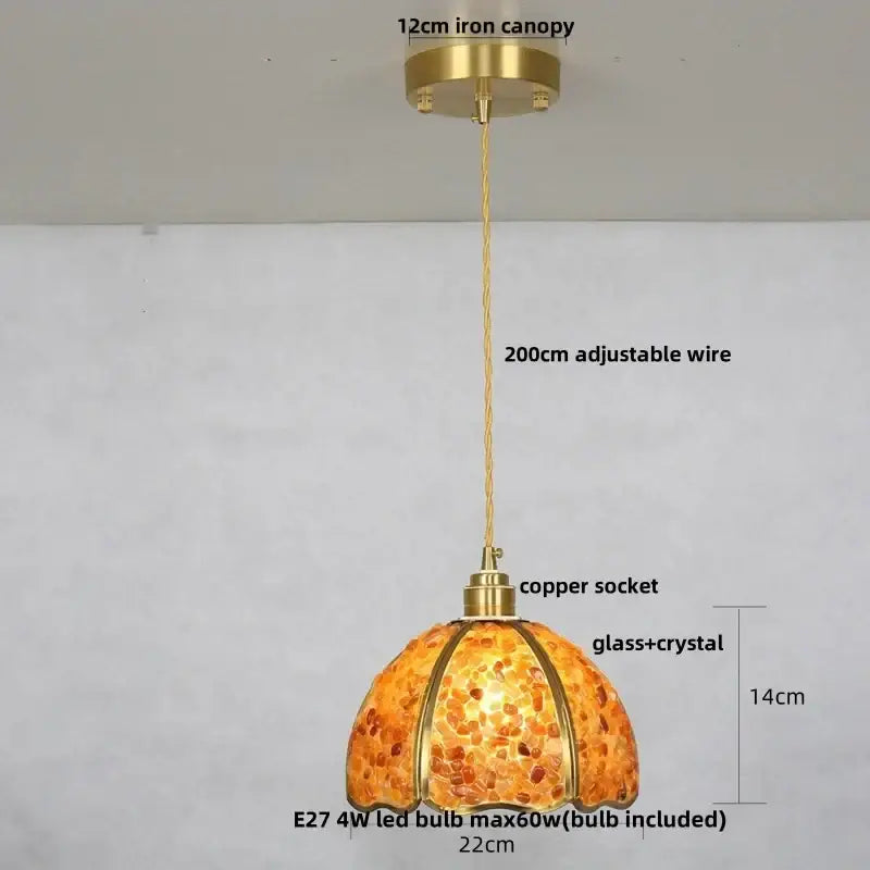 A warm amber glass and crystal copper walnut led pendant light with brass iron canopy for dining room decorbites
