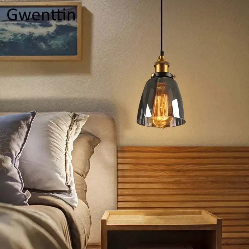 A sleek black glass and brass industrial glass pendant light with exposed filament bulb for kitchen decorbites industrial use
