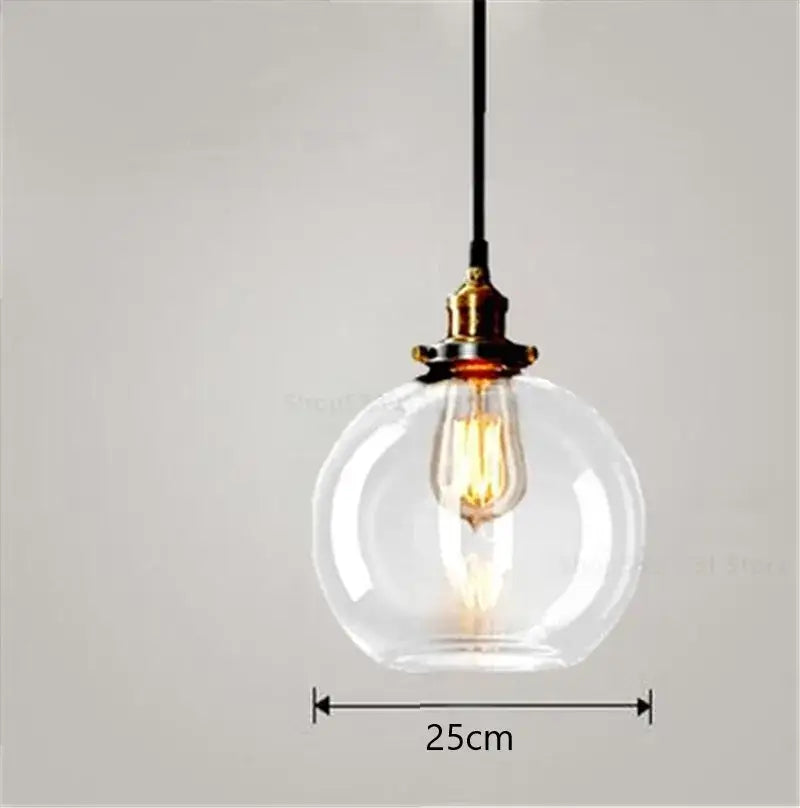 Vintage smoked glass ball pendant lights set of 4 with clear glass globe, brass fixture, and exposed filament bulb by decorbites glass ball