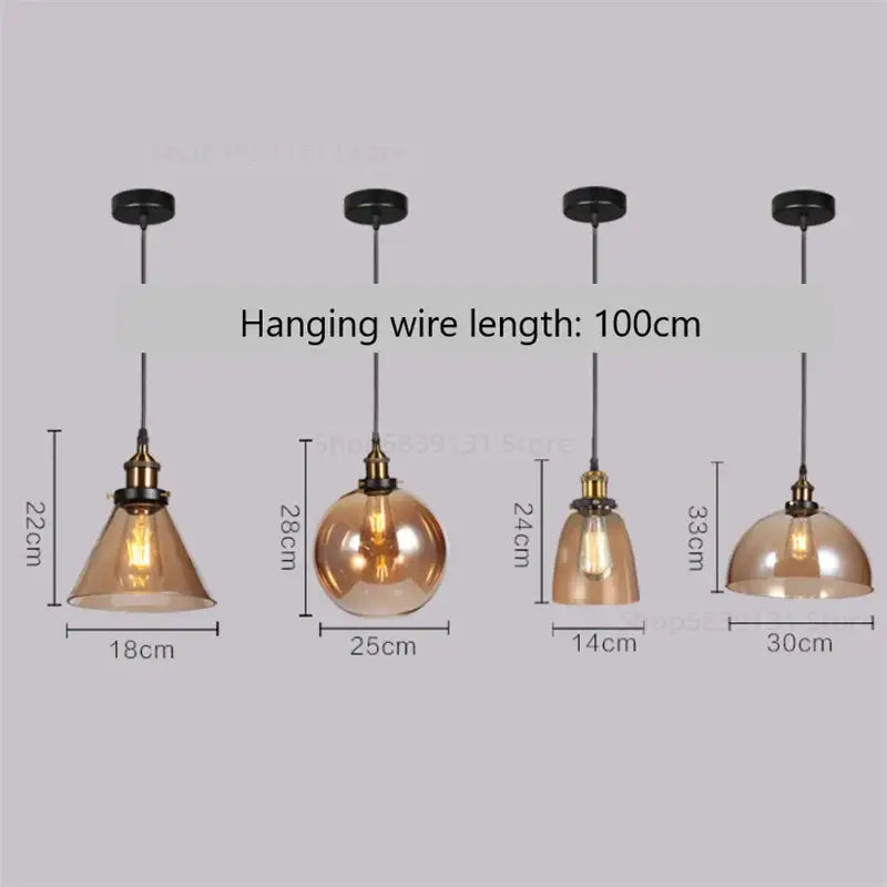 Set of four vintage-style pendant lights with amber glass ball shades and brass fixtures for kitchen decorbites glass ball accents