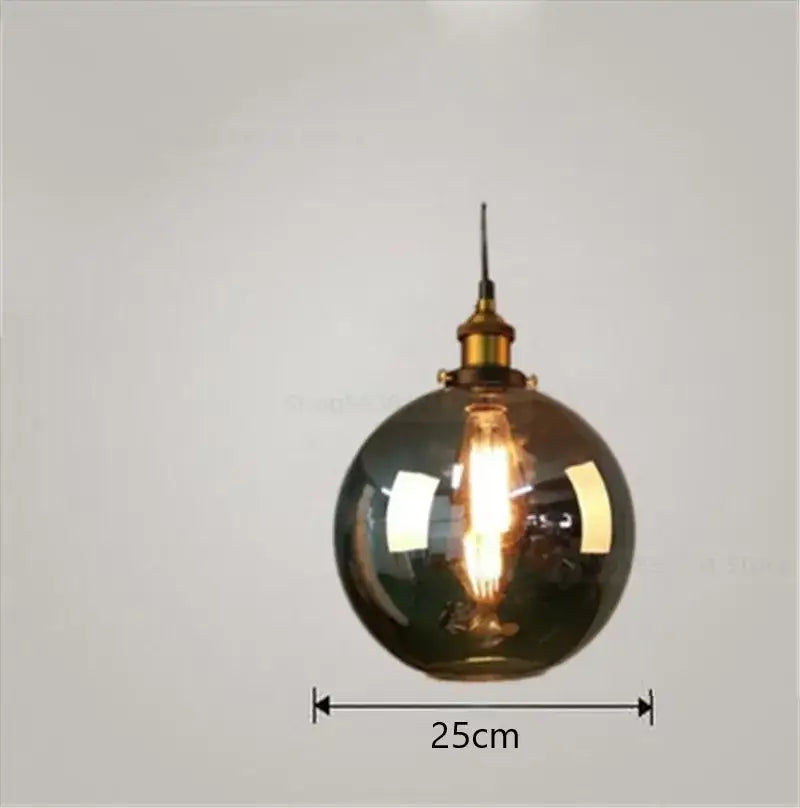 A sleek 25cm diameter vintage smoked glass ball pendant light with brass hardware perfect for kitchen decorbites decor