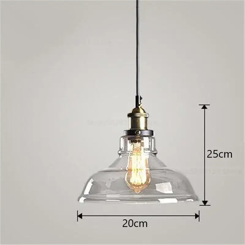 Clear glass dome pendant light with brass-finished socket and exposed filament bulb from vintage smoked glass ball pendant lights set by decorbites glass ball
