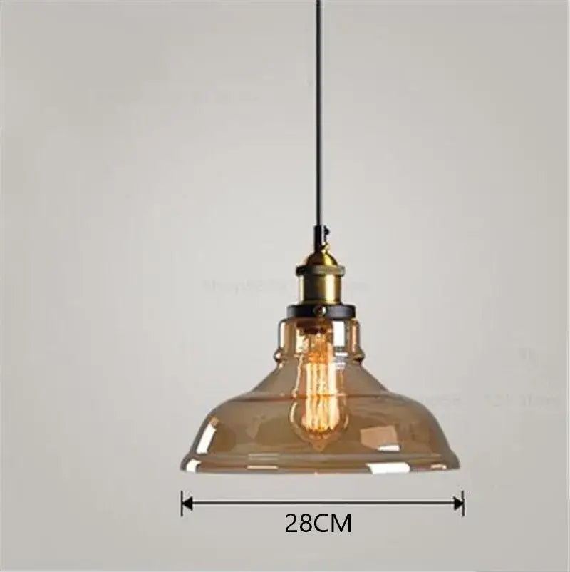 Vintage smoked glass ball pendant lights set of 4 with amber glass ball, brass fixture, and exposed filament bulb by decorbites glass ball