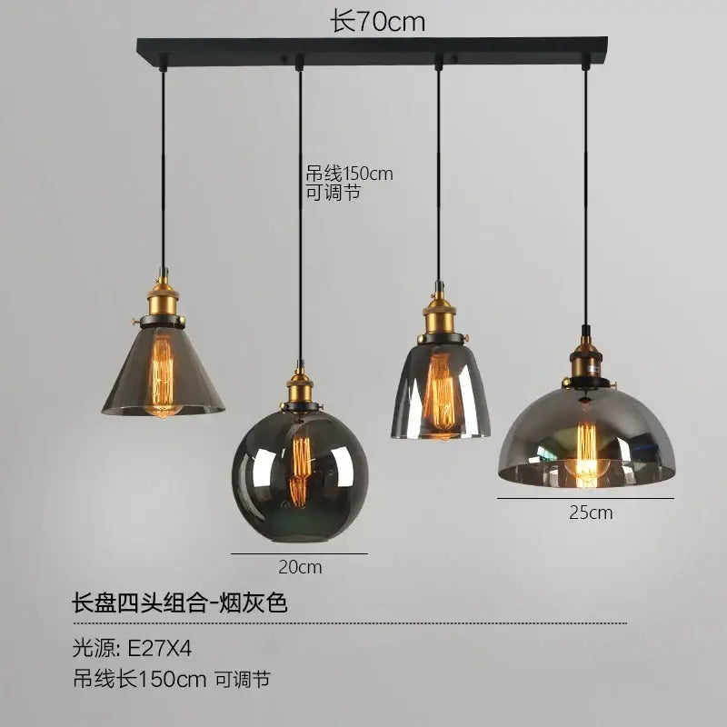 Industrial-style pendant lights set of 4 with smoked glass ball shades and brass accents on black ceiling mount decorbites glass ball