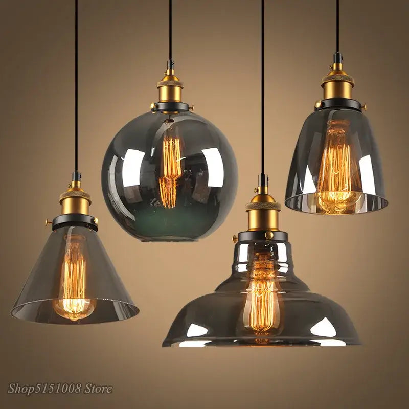 Set of four vintage smoky grey glass pendant lights with brass accents and exposed filament bulbs for kitchen decorbites smoky grey