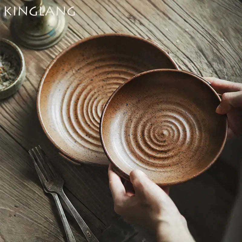 Vintage speckled brown ceramic round swallow plate with rustic earthy glaze and concentric circular ridges by decorbites ceramic round