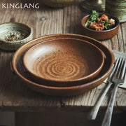 Earthy brown decorbites ceramic round swallow plate with speckled glaze and concentric ridges for dining room use
