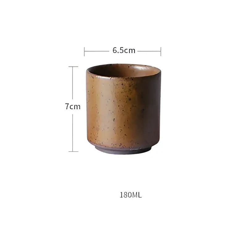 A rustic brown decorbites ceramic round mug with speckled glaze and rounded edges complements the ceramic round swallow plate