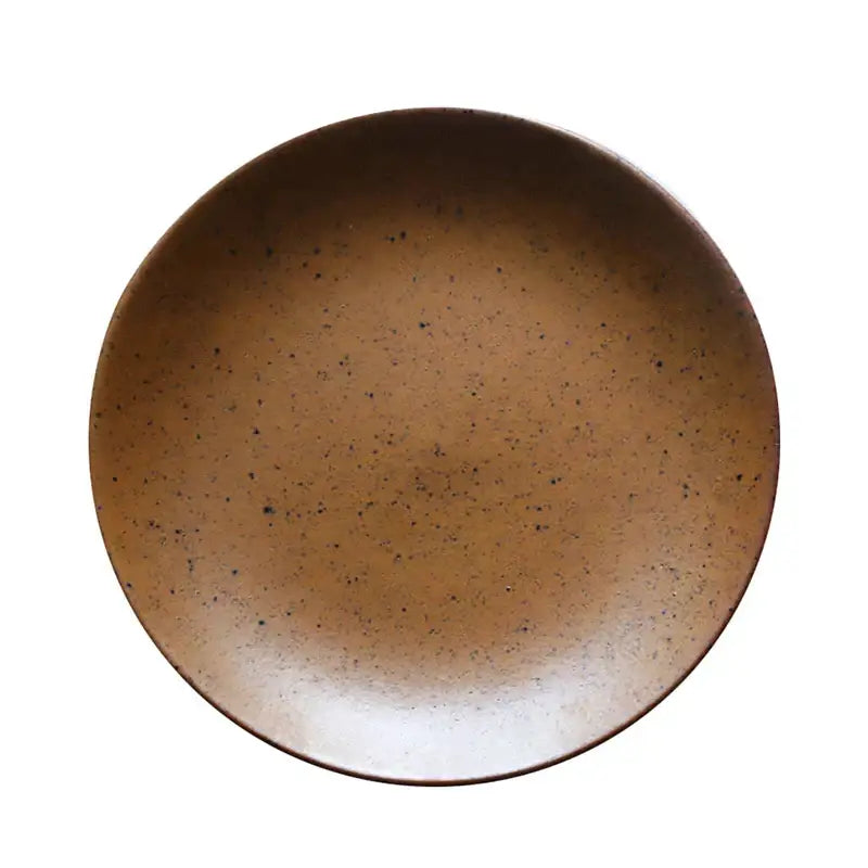 A rustic brown ceramic round swallow plate with speckled glaze and raised rim from decorbites ceramic round collection