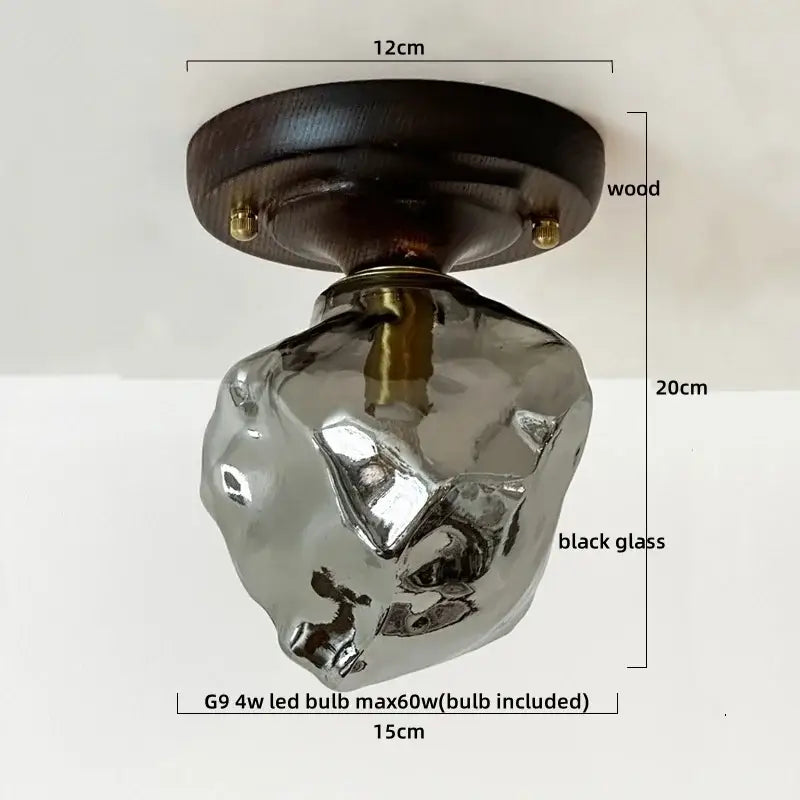 A sleek black glass copper led ceiling lamp with brass accents and dark wood mount for dining room lighting