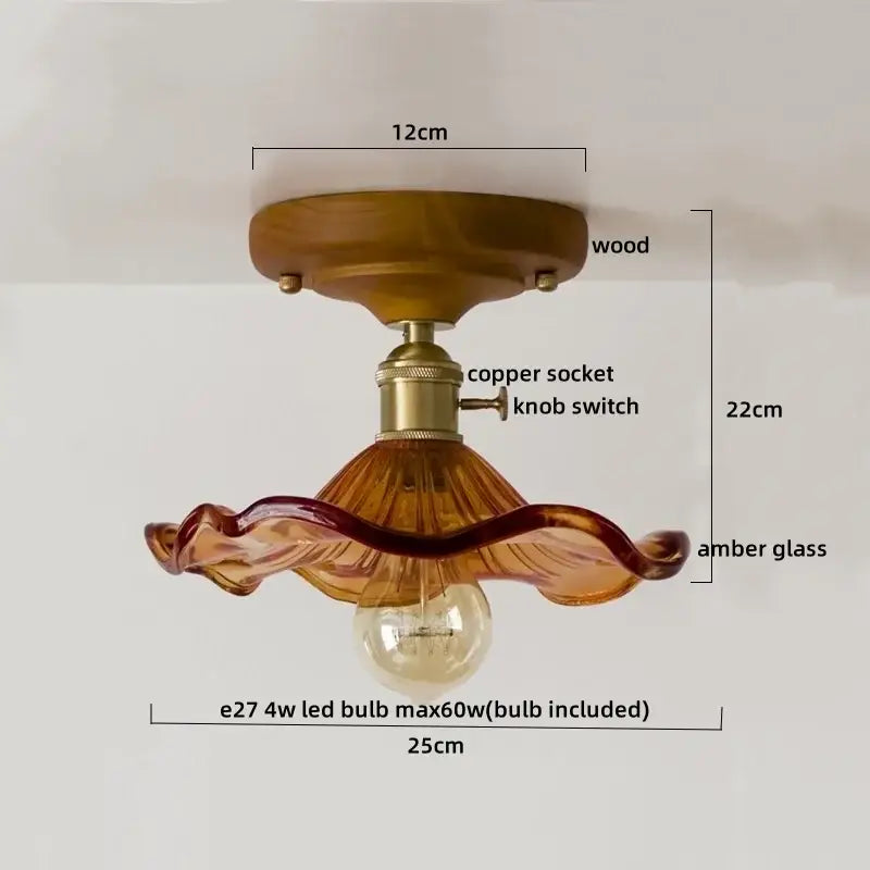 A warm amber glass copper led ceiling lamp with wooden base and brass accents for dining room lighting
