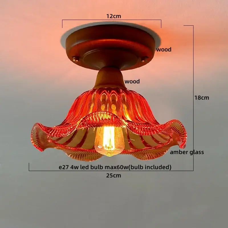 A warm amber glass copper led ceiling lamp with wooden base and ruffled design for dining room illumination