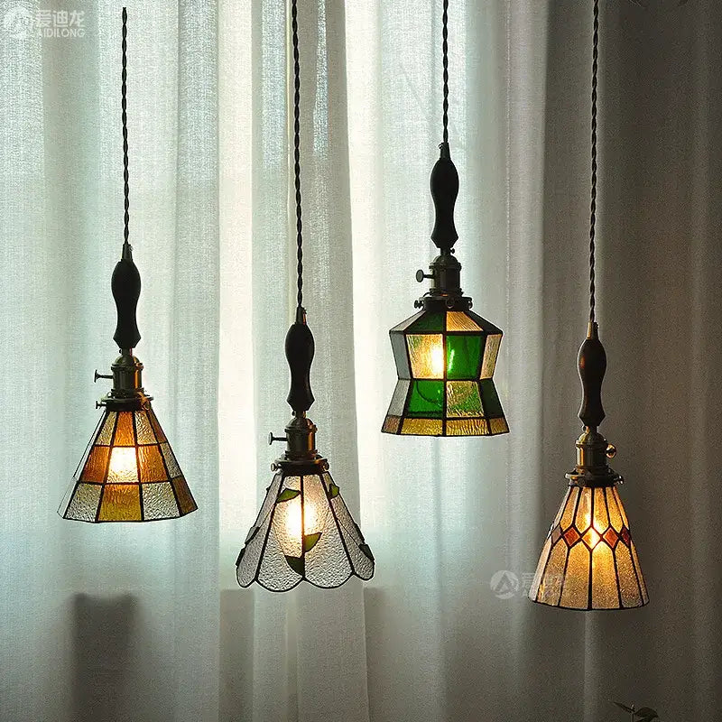 Vintage stained glass copper pendant light with knob switch wood finials featuring amber green geometric patterns