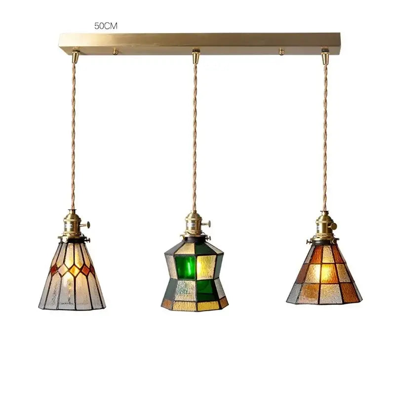 Vintage stained glass copper pendant light with brass finish three-light fixture amber green cream shades and wood knob switch
