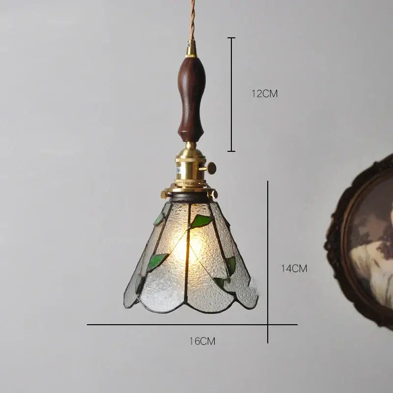 Vintage stained glass copper pendant light with knob switch dark wood handle brass hardware and green leaf motifs