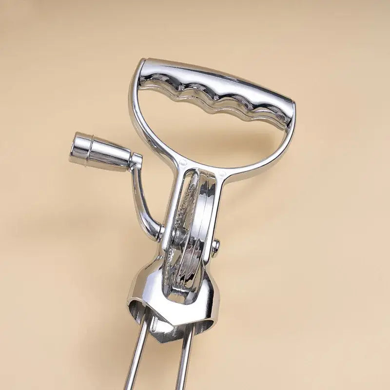 Vintage stainless steel manual egg beater with shiny chrome finish and dual hand crank for efficient whisking