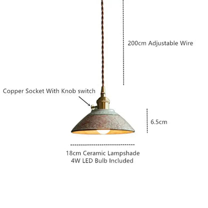 Vintage striped coloured glaze pendant light with muted green ceramic shade and brass accents for dining room decorbites