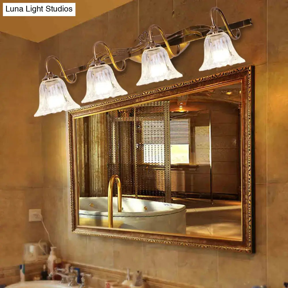 Gold-toned vintage style wall light with four frosted glass bell-shaped shades and ornate curved arms for bathroom vanity