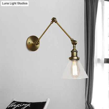 Brass-finished vintage style adjustable wall sconce with frosted glass shade and exposed edison bulb in satin brass