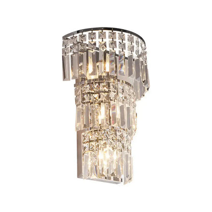 Vintage style clear crystal tiered chrome wall sconce with cascading faceted prisms for hallway lighting