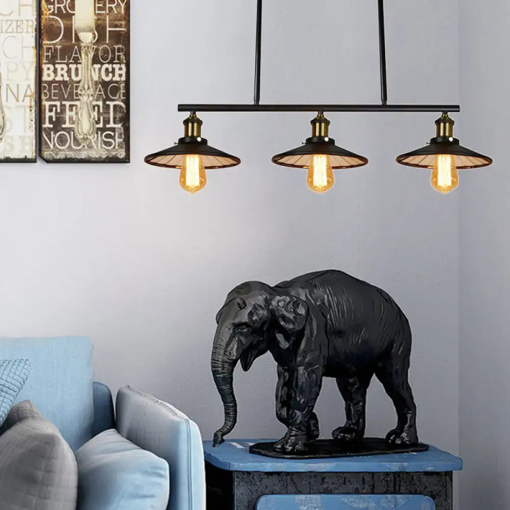 Black matte-finished elephant sculpture with textured surface on blue table complementing vintage style conic island decor