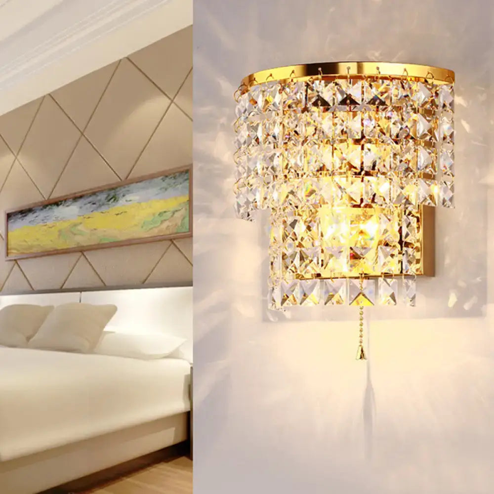 Vintage style wall sconce gold finished with cascading clear faceted crystal tiers for bedroom lighting