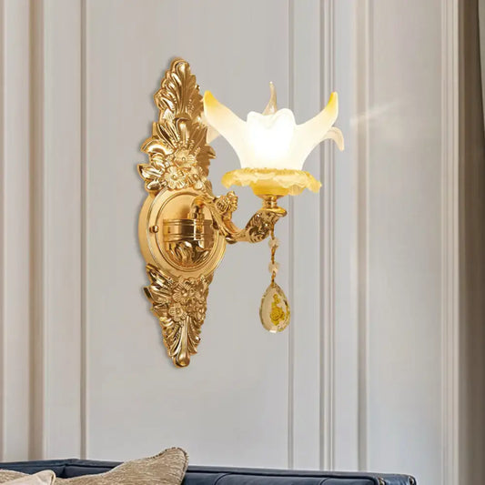 Vintage style gold wall light with opal glass flower-shaped shade and crystal teardrop for bedroom decor