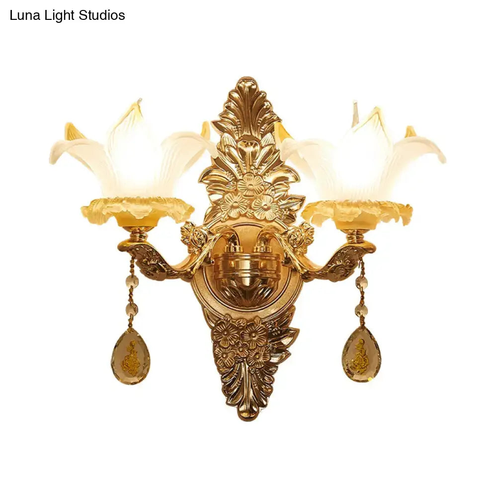 Vintage style gold wall light with opal glass lily shades and amber crystal accents for bedroom decor