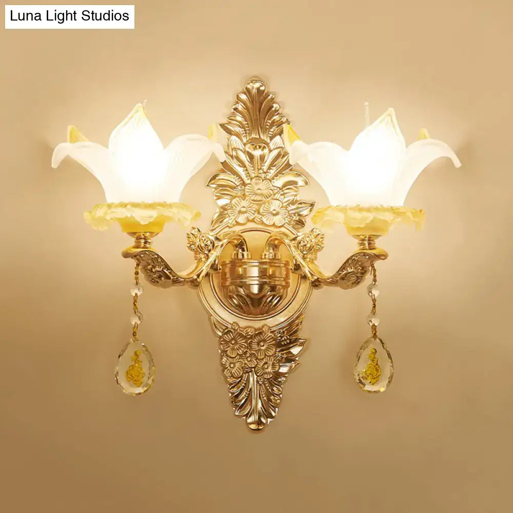 Vintage style gold wall light with opal glass lily shades and crystal pendants for elegant bedroom decor
